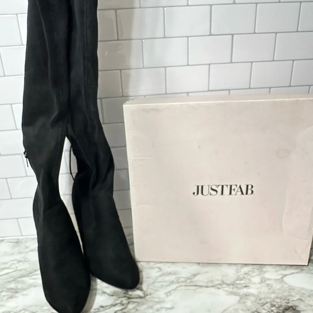 Over the Knee suede black lace tie stiletto heeled boots.